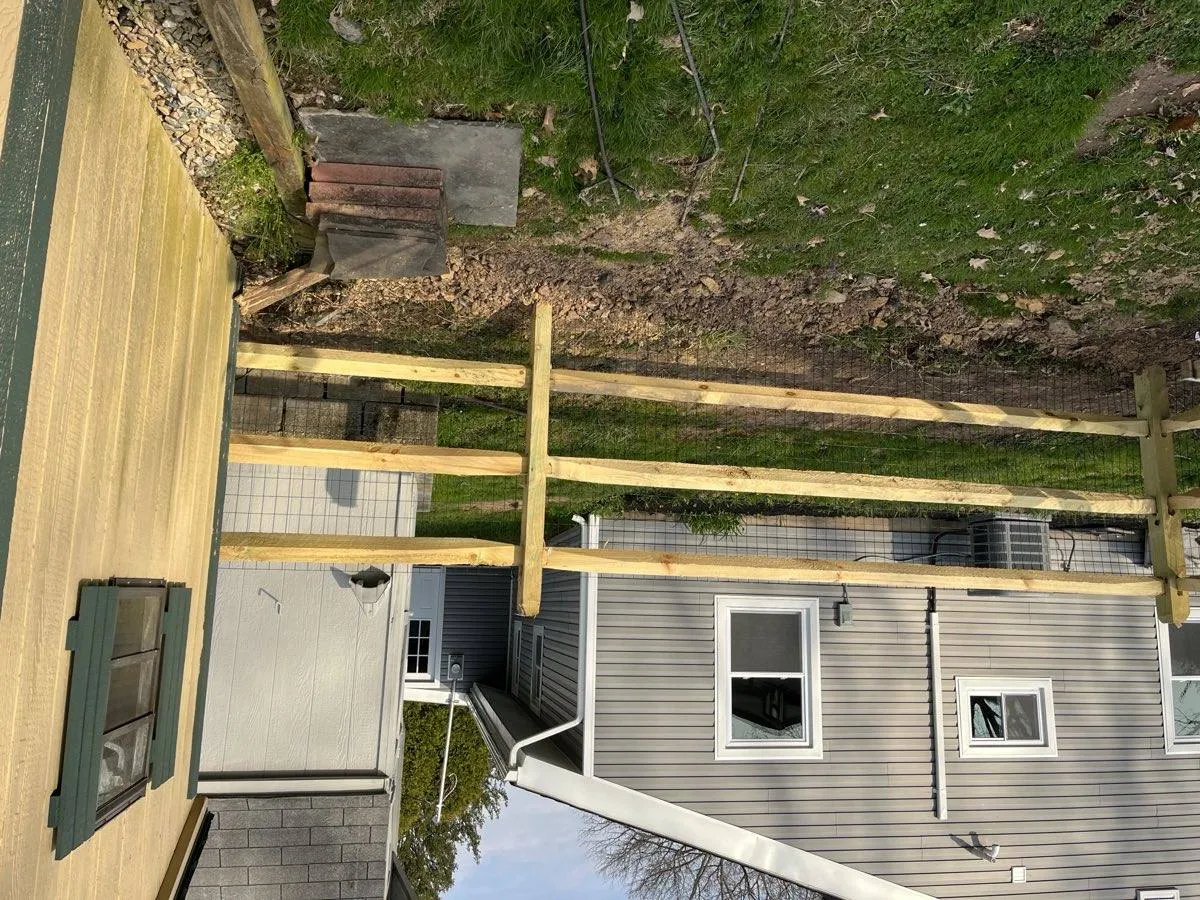 Split rail fence with welded wire mesh for pets