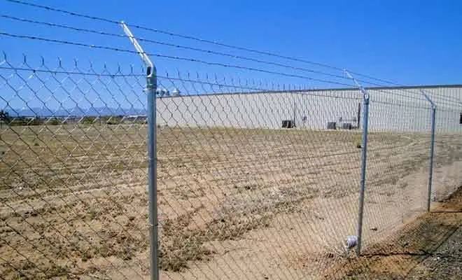 Chain link fence with barbed wire
